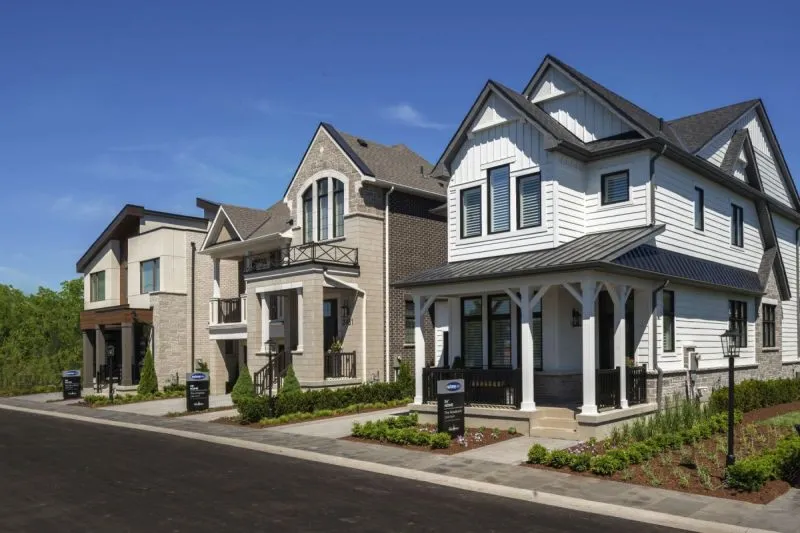 Model homes open for viewing on a street at Upper Joshua Creek, Oakville